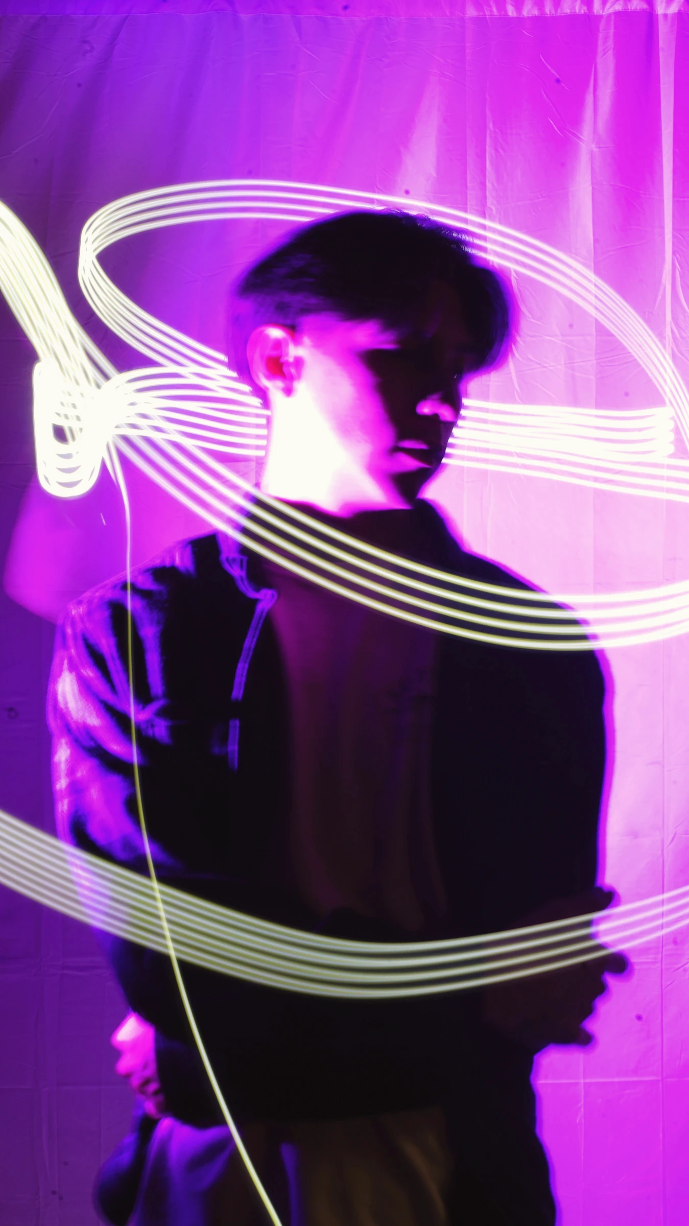 Artist portrait with purple light trails