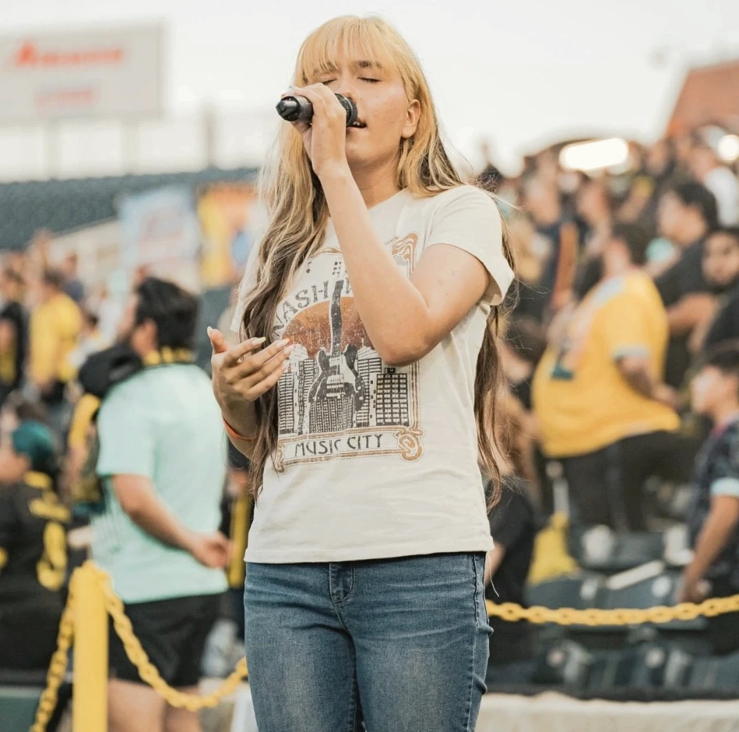 Vohn performing live with a microphone