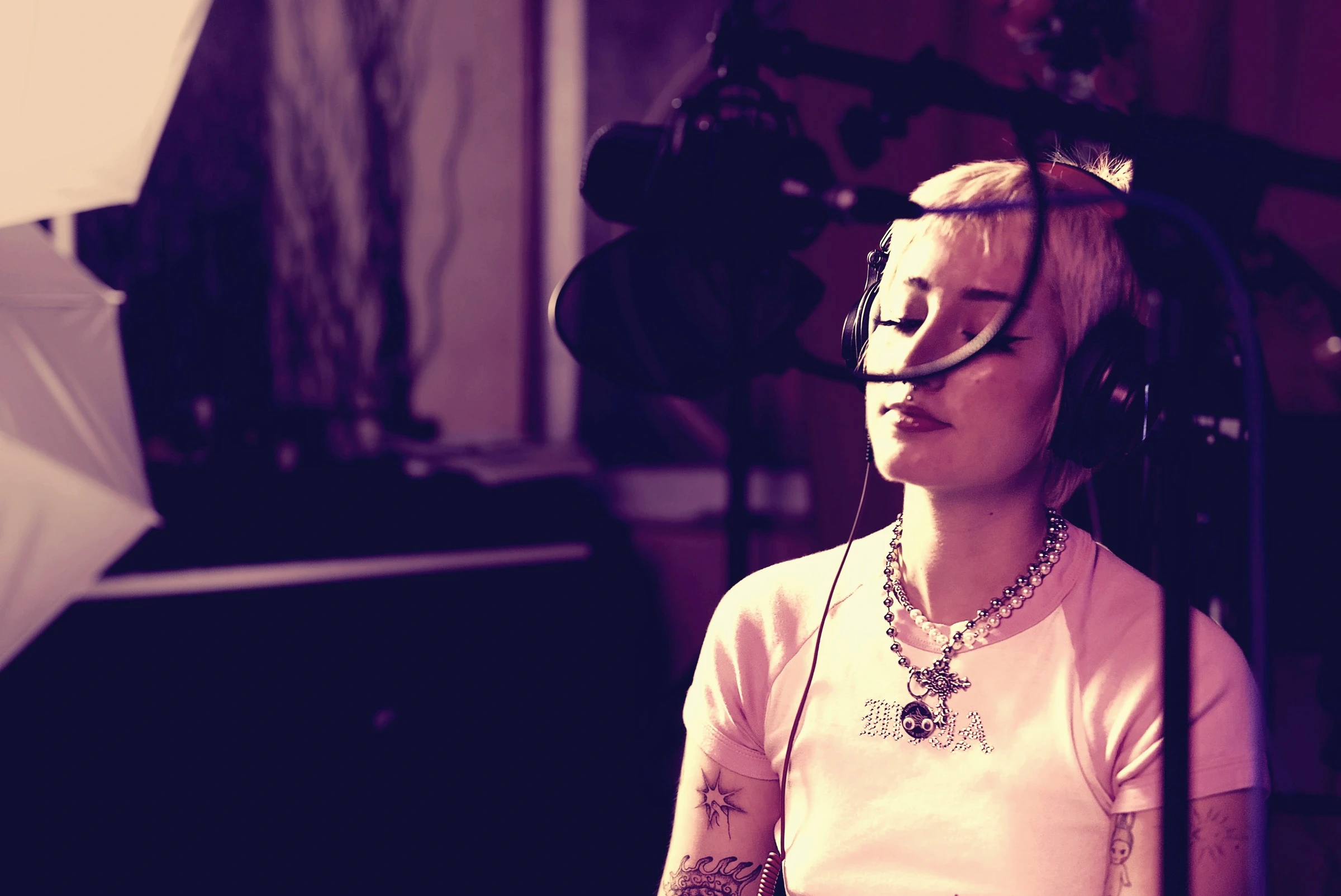 Country Medicine recording with headphones in Studio A